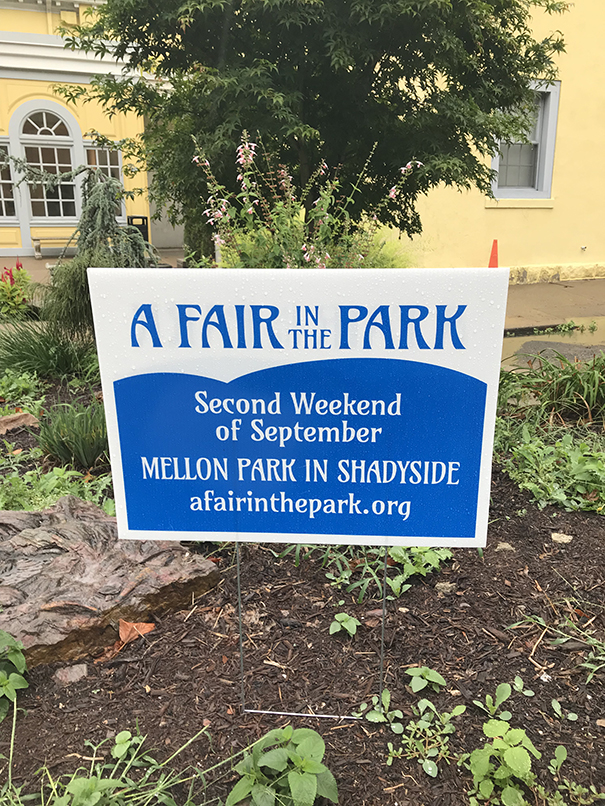 A sign that reads "A FAIR in the PARK Second Weekend of September Mellon Park in Shadyside"
